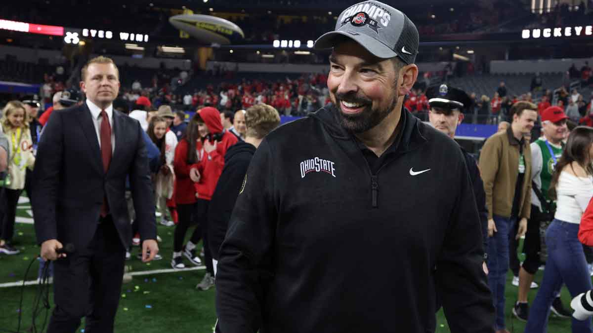 Ohio State Buckeyes head coach Ryan Day celebrates after winning the College Football Playoff semifinal against the Texas Longhorns in the Cotton Bowl at AT&T Stadium.