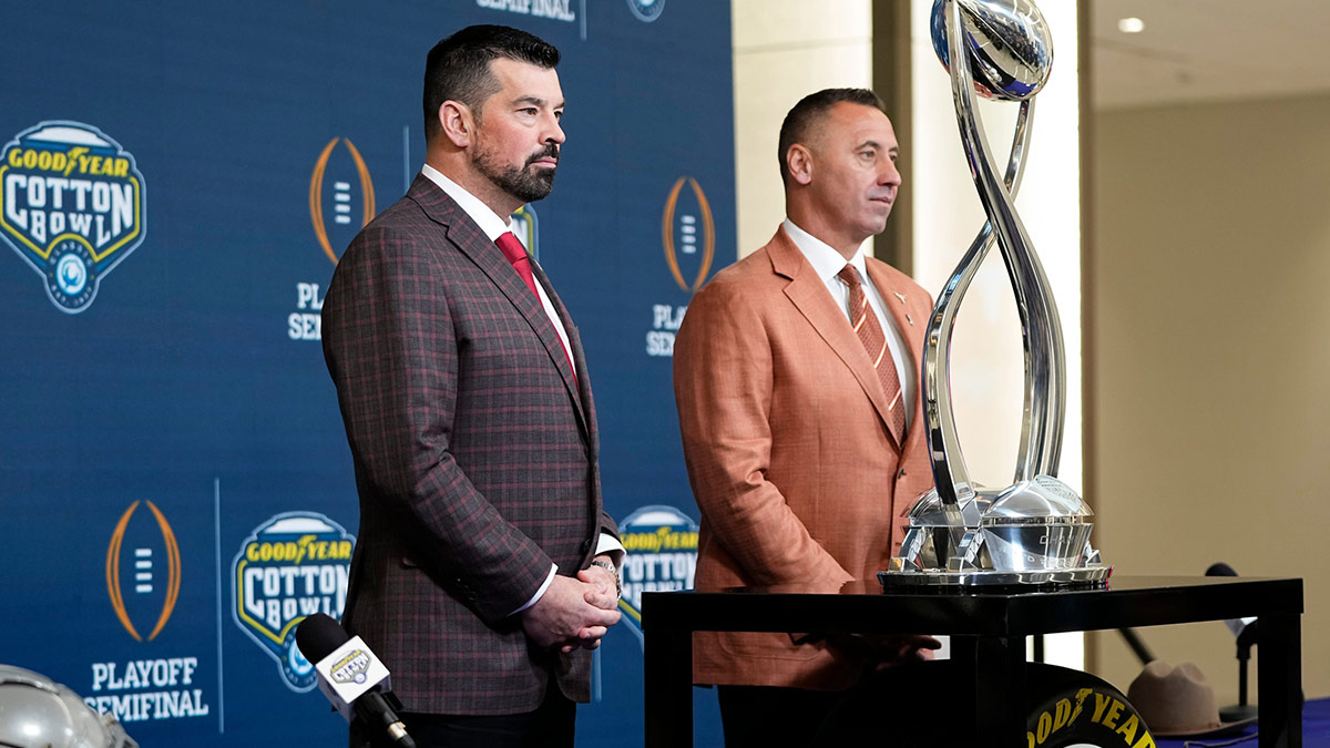Ohio State Buckeyes head coach Ryan Day and Texas Longhorns head coach Steve Sarkisian stand together following a press conference at AT&T Stadium prior to the College Football Playoff semifinal at the Cotton Bowl Classic