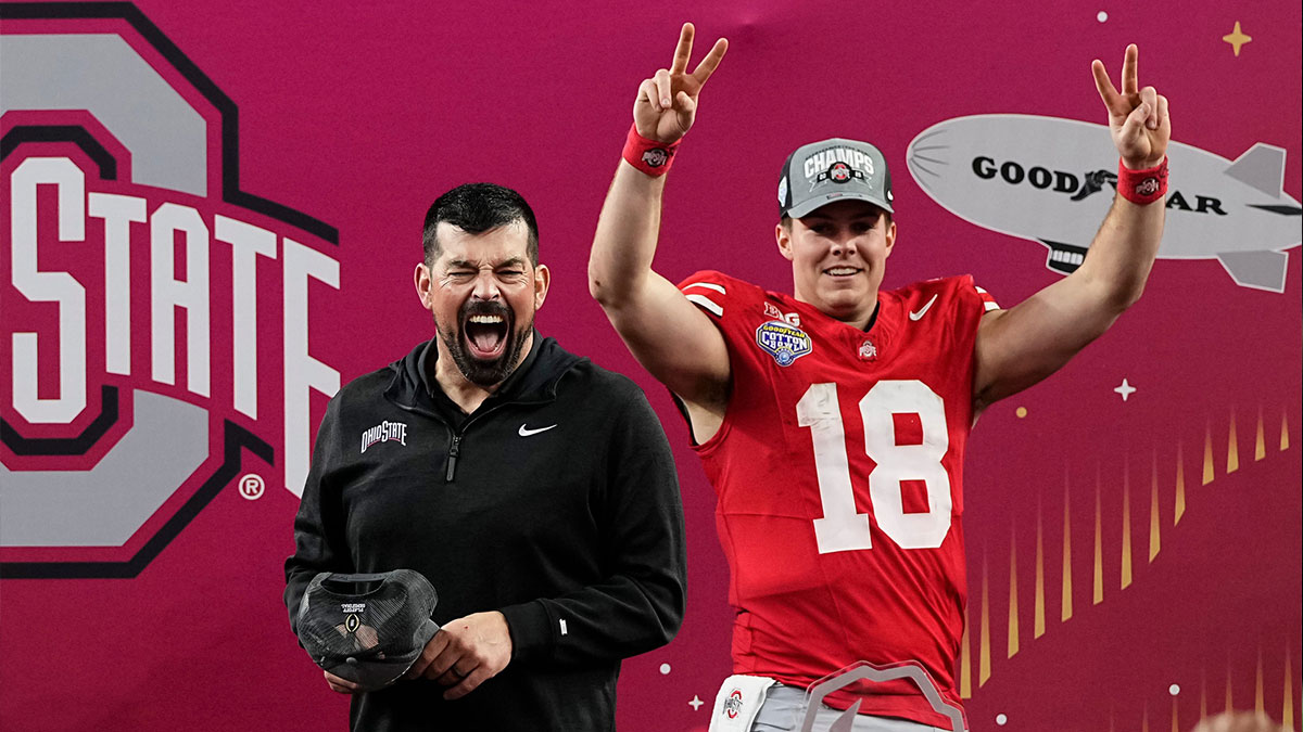 Ohio State Buckeyes head coach Ryan Day celebrates with quarterback Will Howard (18) after a 28-14 victory over the Texas Longhorns in the Cotton Bowl Classic College Football Playoff semifinal game at AT&T Stadium in Arlington, Texas on Jan. 10, 2025.