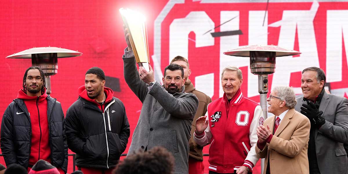 Ohio State Buckeyes head coach Ryan Day hoists the championship trophy during the Ohio State Buckeyes College Football Playoff National Championship celebration at Ohio Stadium in Columbus on Jan. 26, 2025.