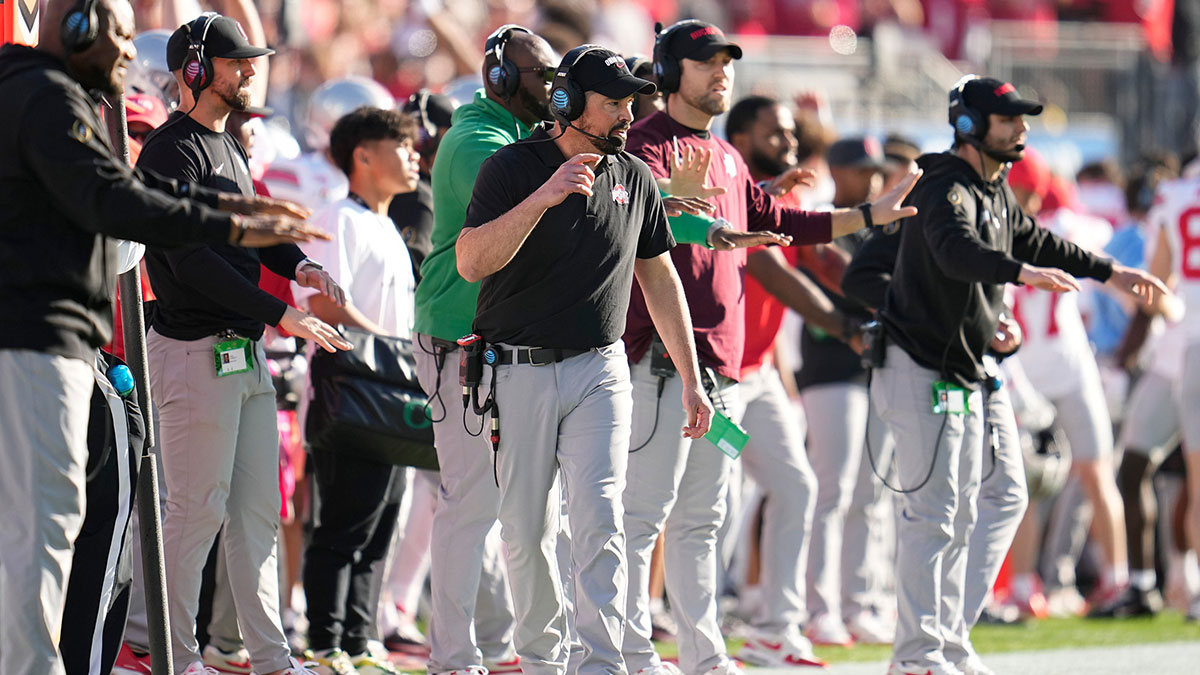 Ohio State Buckeyes head coach Ryan Day watches from the sideline during the first half of the College Football Playoff quarterfinal against the Oregon Ducks at the Rose Bowl