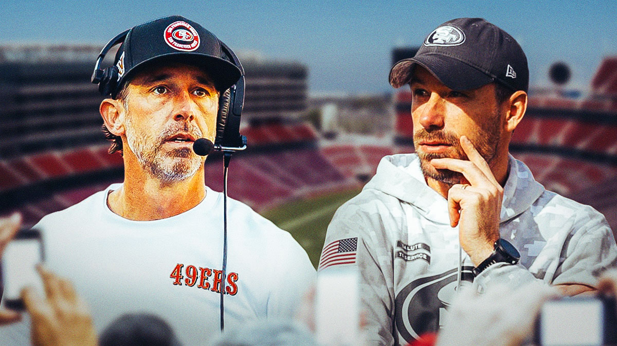 Kyle Shanahan standing next to Klay Kubiak