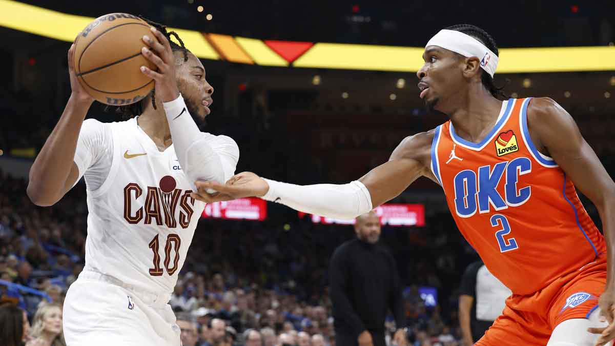 Oklahoma City Thunder guard Shai Gilgeous-Alexander (2) defends a drive by Cleveland Cavaliers guard Darius Garland (10) during the second quarter at Paycom Center.