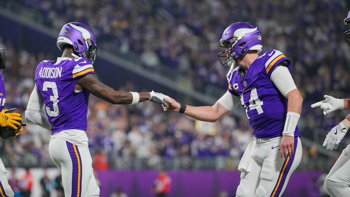 Minnesota Vikings wide receiver Jordan Addison (3) celebrates his touchdown with quarterback Sam Darnold (14) against Green Bay Packers in the third quarter at U.S. Bank Stadium.