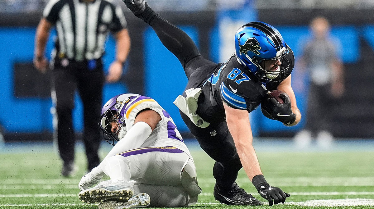 Detroit Lions tight end Sam LaPorta (87) makes a catch against Minnesota Vikings safety Camryn Bynum (24) during the first half at Ford Field in Detroit on Sunday, Jan. 5, 2025.