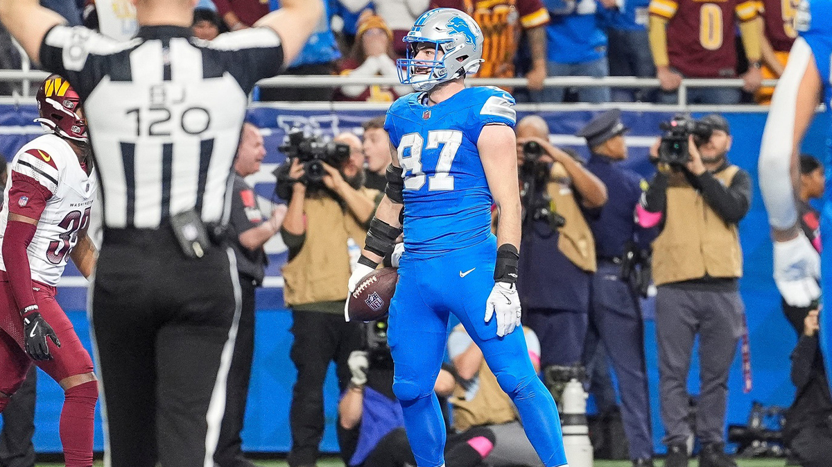 Detroit Lions tight end Sam LaPorta (87) celebrates a touchdown against the Washington Commanders during the first half of the NFC divisional round. 