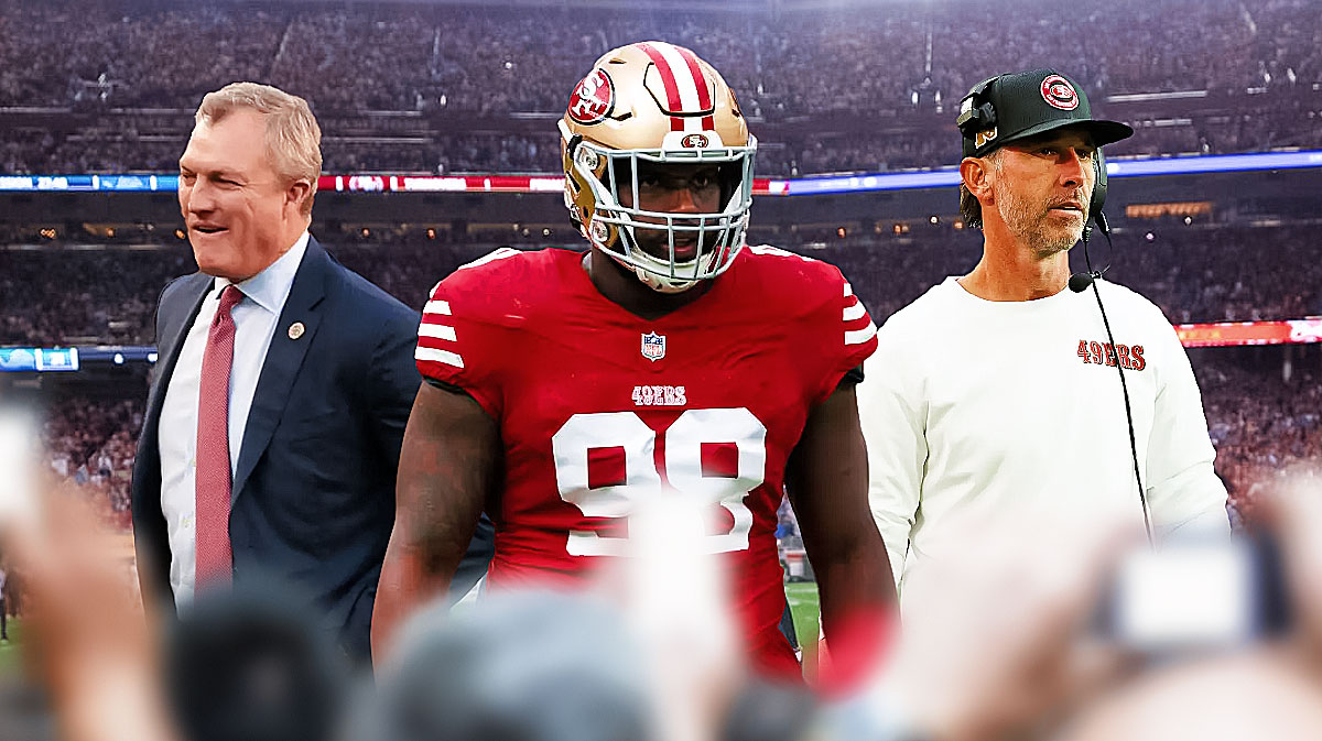 Javon Hargrave in a San Francisco 49ers uniform with 49ers coach Kyle Shanahan and GM John Lynch as Hargrave was released by the team.