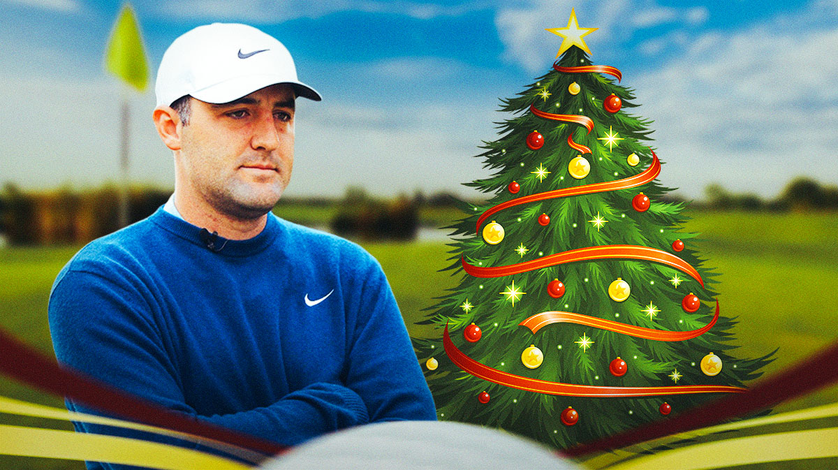 scottie scheffler next to a christmas tree