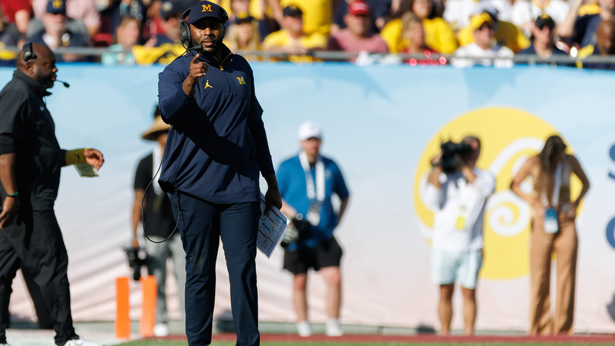 Michigan Wolverines head coach Sherrone Moore gestures from the field against the Alabama Crimson Tide during the second half at Raymond James Stadium.