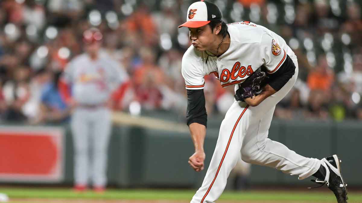 Baltimore Orioles relief pitcher Shintaro Fujinami (14) throws a ninth inning pitch against the St. Louis Cardinals at Oriole Park at Camden Yards.