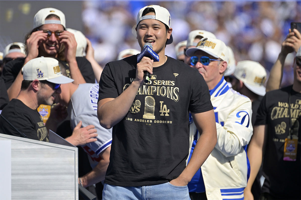 Los Angeles Dodgers designated hitter Shohei Ohtani (17) to speak to fans, in english, during the World Series Championship Celebration at Dodger Stadium. 