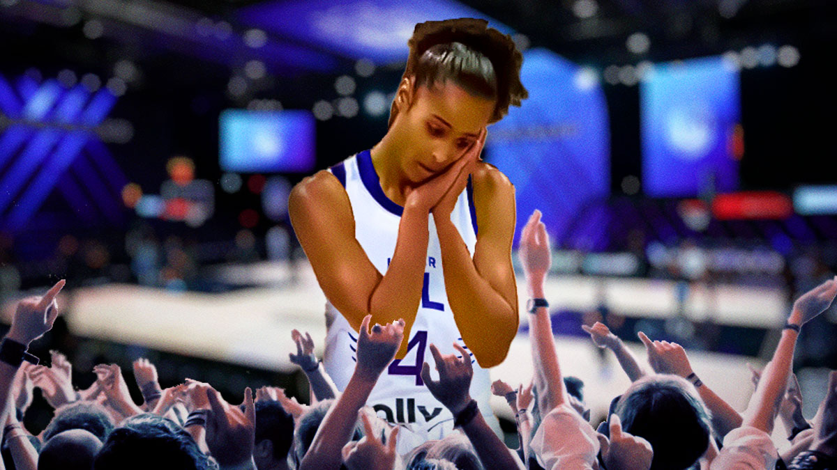 Skylar Diggins-Smith in an Unrivaled Lunar Owls jersey, doing the night-night celebration and fans going crazy below her.
