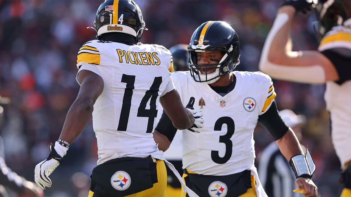 Pittsburgh Steelers wide receiver George Pickens (14) celebrates his touchdown catch with quarterback Russell Wilson (3) during the first quarter against the Cincinnati Bengals at Paycor Stadium.