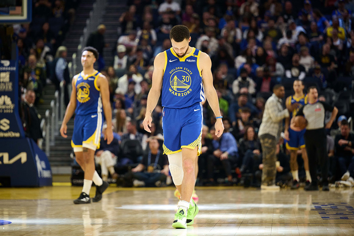 Golden State Warriors guard Stephen Curry (30) walks on the court after a timeout against the Phoenix Suns in the second quarter at Chase Center.