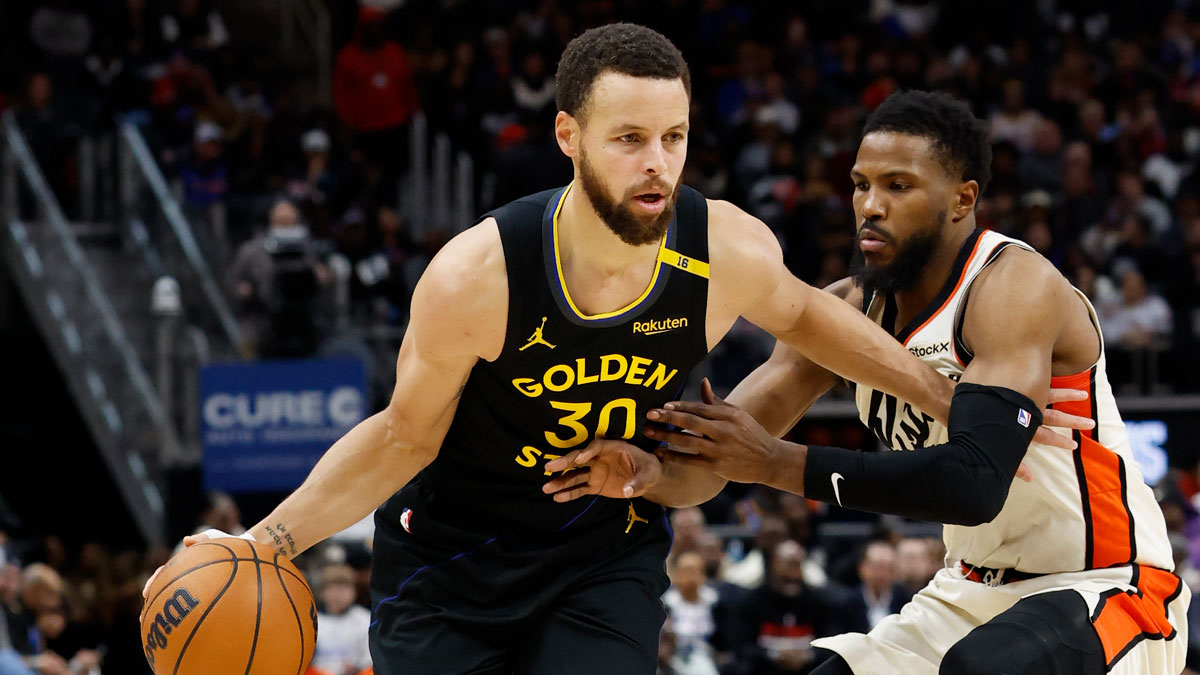 Golden State Warriors guard Stephen Curry (30) dribbles past Detroit Pistons guard Malik Beasley (5) in the second half at Little Caesars Arena. 