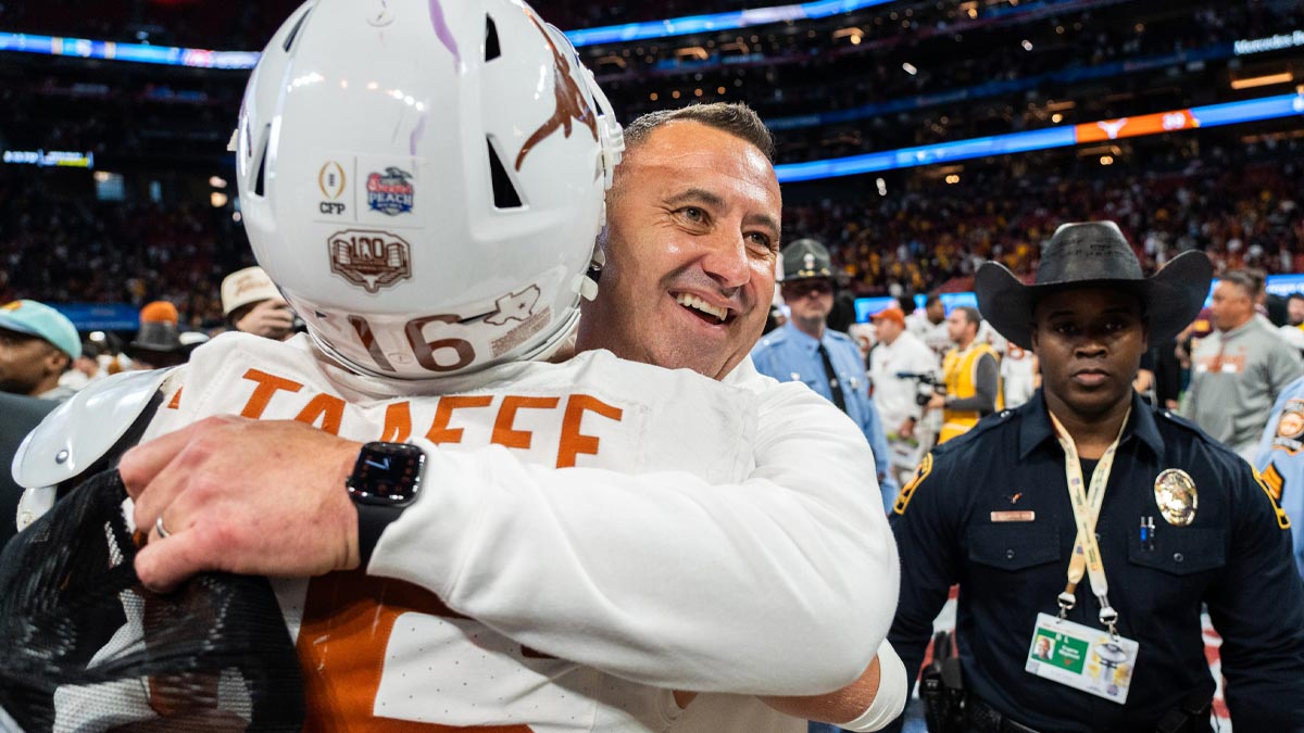 Texas Longhorns head coach Steve Sarkisian embraces Texas Longhorns defensive back Michael Taaffe (16) as they celebrate their win in the Peach Bowl College Football Playoff quarterfinal against Arizona State
