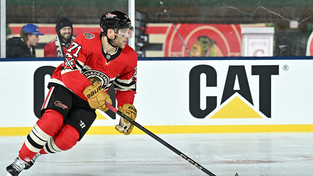 Chicago Blackhawks left wing Taylor Hall (71) skates with the puck against the St. Louis Blues during the third period in the Winter Classic at Wrigley Field.