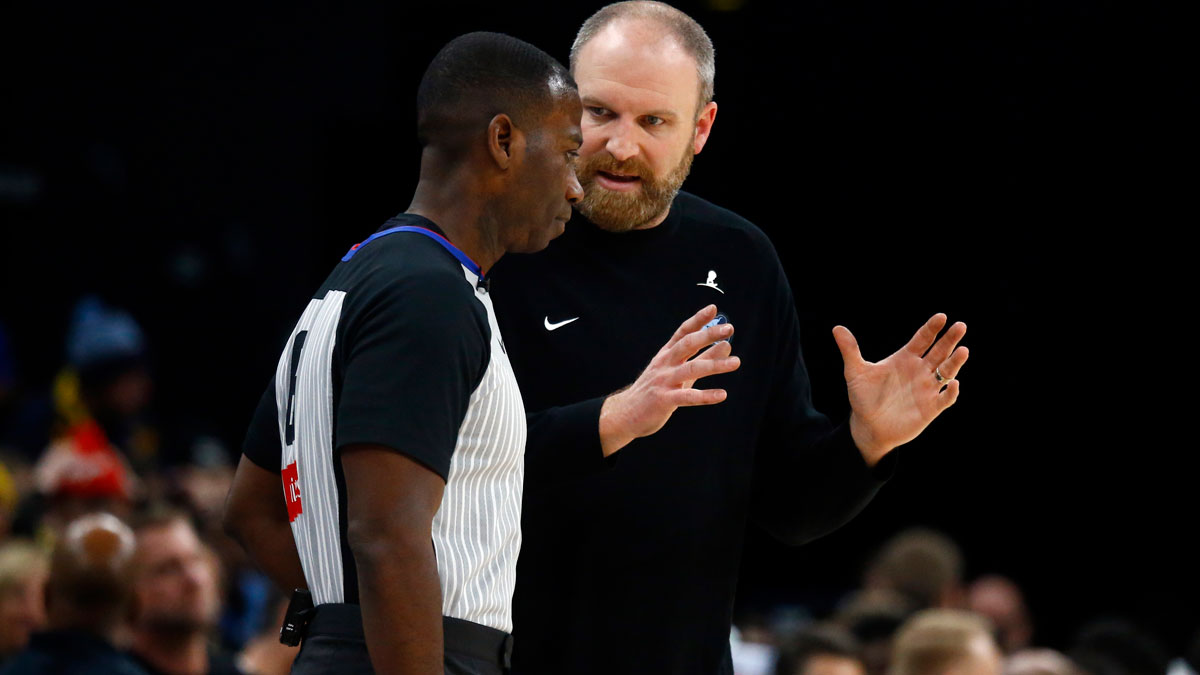 Memphis Grizzlies head coach Taylor Jenkins talks with an official during the fourth quarter against the Houston Rockets at FedExForum.
