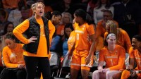 Tennessee head coach Kim Caldwell works with the team during the first quarter against Vanderbilt.