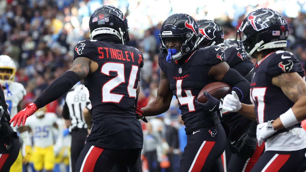 Houston Texans cornerback Kamari Lassiter (4) celebrates an interception in the second quarter against the Los Angeles Chargers in the AFC wild card game at NRG Stadium. 