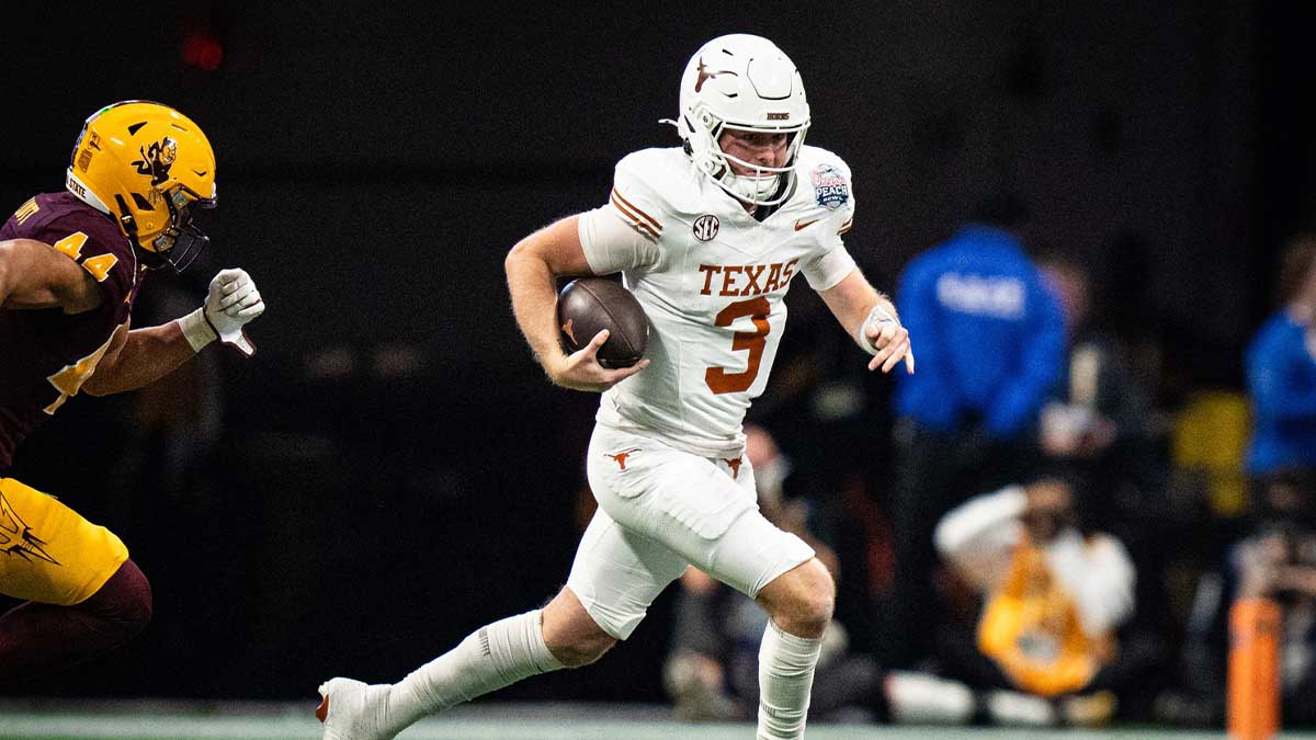 Texas Longhorns quarterback Quinn Ewers (3) runs the ball as Arizona State Sun Devils linebacker Keyshaun Elliott (44) chases in the second quarter as the Texas Longhorns play the Arizona State Sun Devils in the Peach Bowl College Football Playoff quarterfinal at Mercedes-Benz Stadium in Atlanta, Georgia, Jan. 1, 2025.
