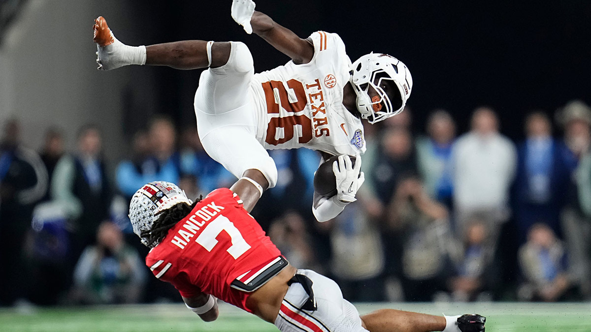 Ohio State Buckeyes cornerback Jordan Hancock (7) tackles Texas Longhorns running back Quintrevion Wisner (26) during the second half of the Cotton Bowl Classic College Football Playoff semifinal game at AT&T Stadium in Arlington, Texas on Jan. 10, 2025. Ohio State won 28-14.