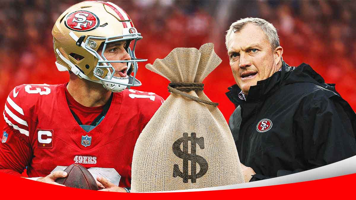 Brock Purdy and John Lynch of the 49ers with a big bag of money between them.