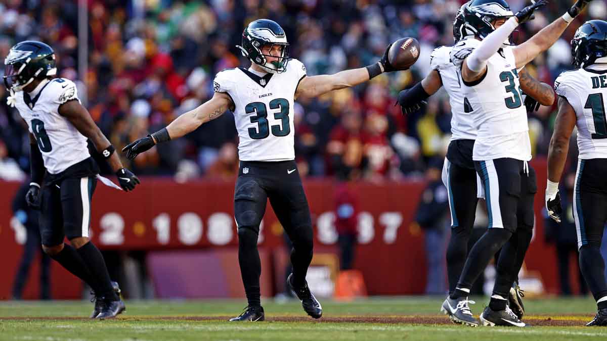 Philadelphia Eagles cornerback Cooper DeJean (33) celebrates after recovering a fumble during the second quarter against the Washington Commanders at Northwest Stadium.