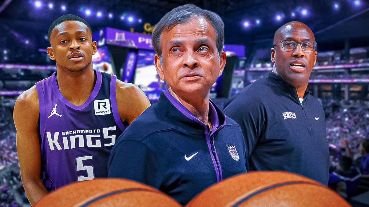 Kings chairman Vivek Randive in between Kings point guard De'Aaron Fox and Kings former head coach Mike Brown