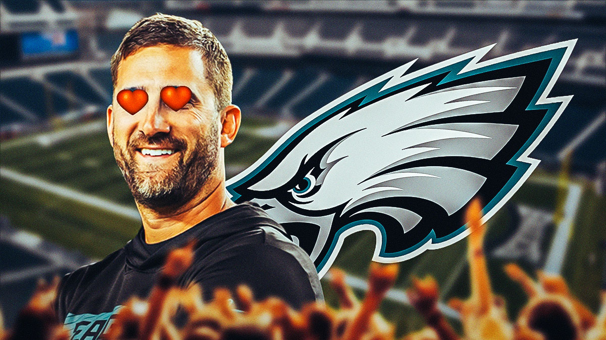 Eagles head coach Nick Sirianni smiling, while the Eagles logo is in the background and has hearts over its eyes.