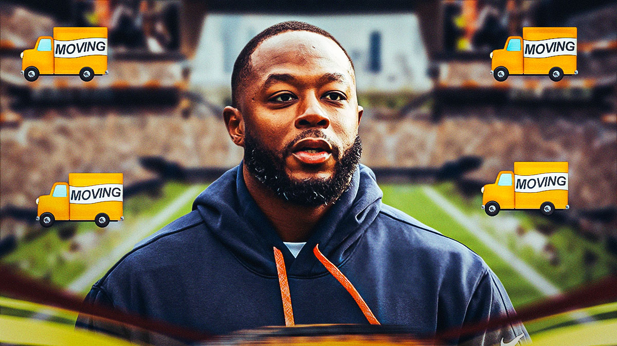 Interim Chicago Bears head coach Thomas Brown surrounded by moving trucks