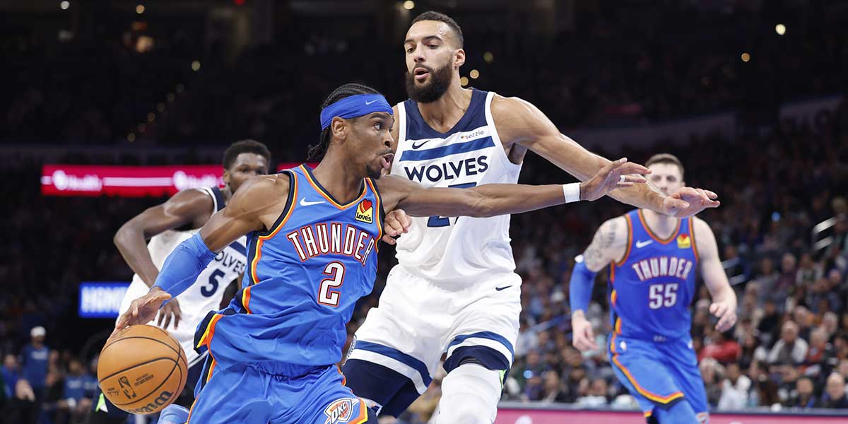 Thunder guard Shai Gilgeous-Alexander (2) drives around Minnesota Timberwolves center Rudy Gobert (27) during the second half at Paycom Center