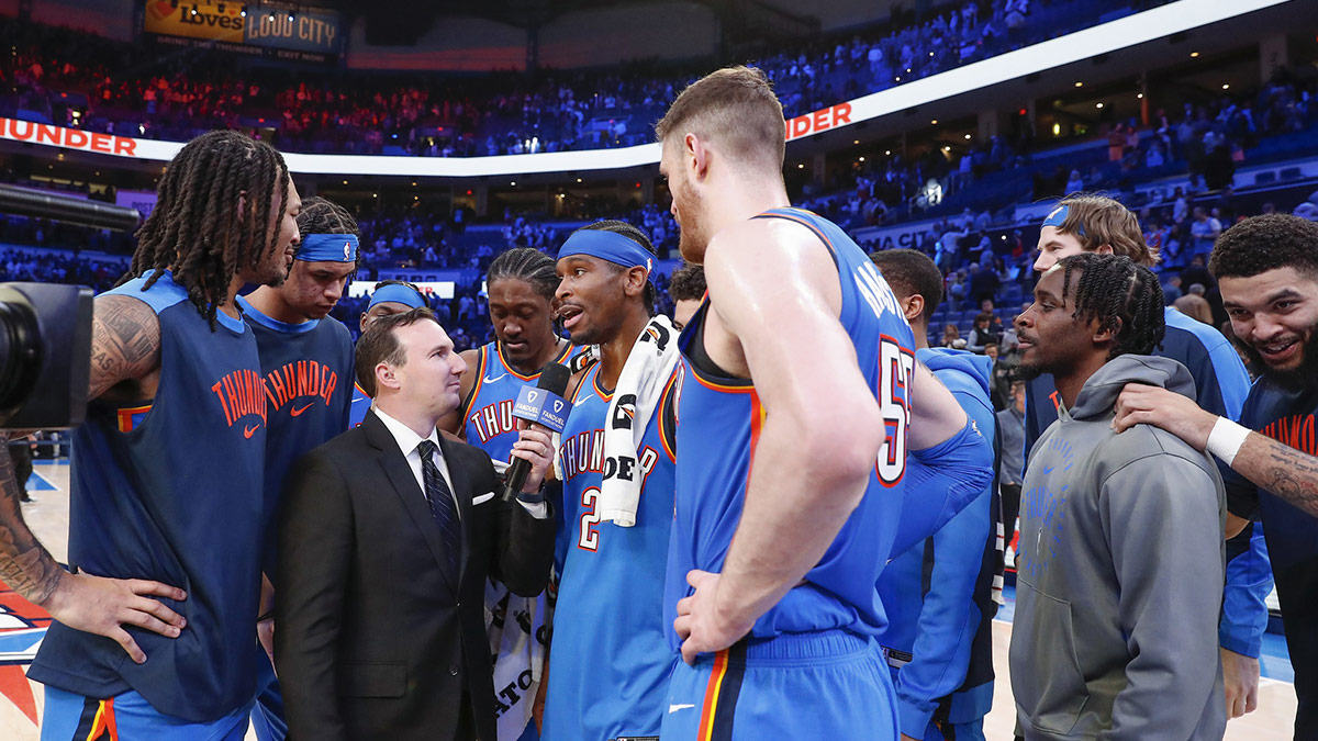 Thunder guard Shai Gilgeous-Alexander (2) and his teammates gather for an interview after their win against the Minnesota Timberwolves at Paycom Center