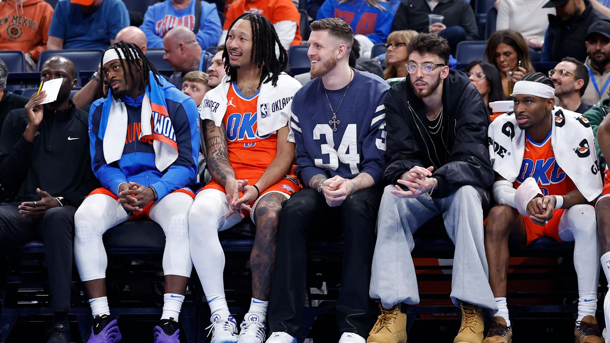 Thunder guard Lou Dort (5), forward Jaylin Williams (6), center Isaiah Hartenstein (55), forward Chet Holmgren (7) and guard Shai Gilgeous-Alexander (2) watch as their team plays against the Cleveland Cavaliers during the fourth quarter at Paicom center