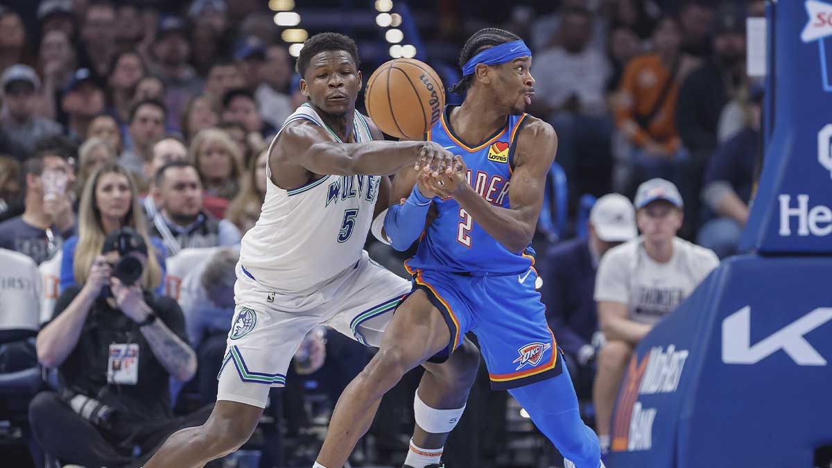 Timberwolves guard Anthony Edwards (5) forces a turn over by Oklahoma City Thunder guard Shai Gilgeous-Alexander (2) during the second quarter at Paycom Center