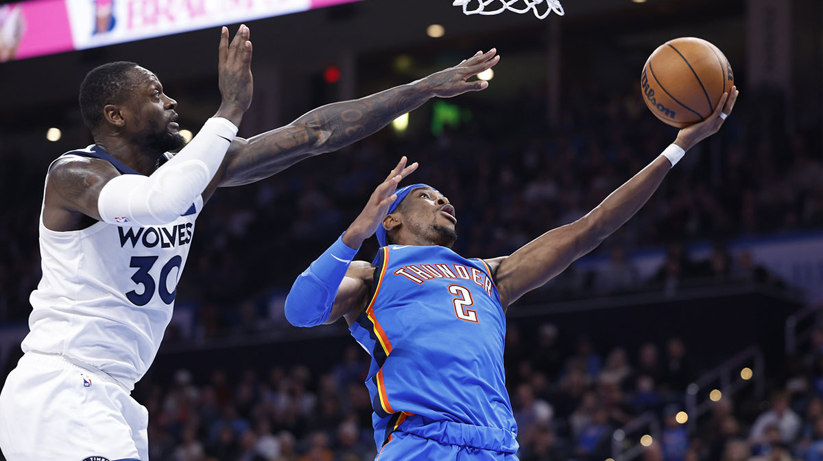 Thunder guard Shai Gilgeous-Alexander (2) goes to the basket beside Minnesota Timberwolves forward Julius Randle (30) during the second half at Paycom Center