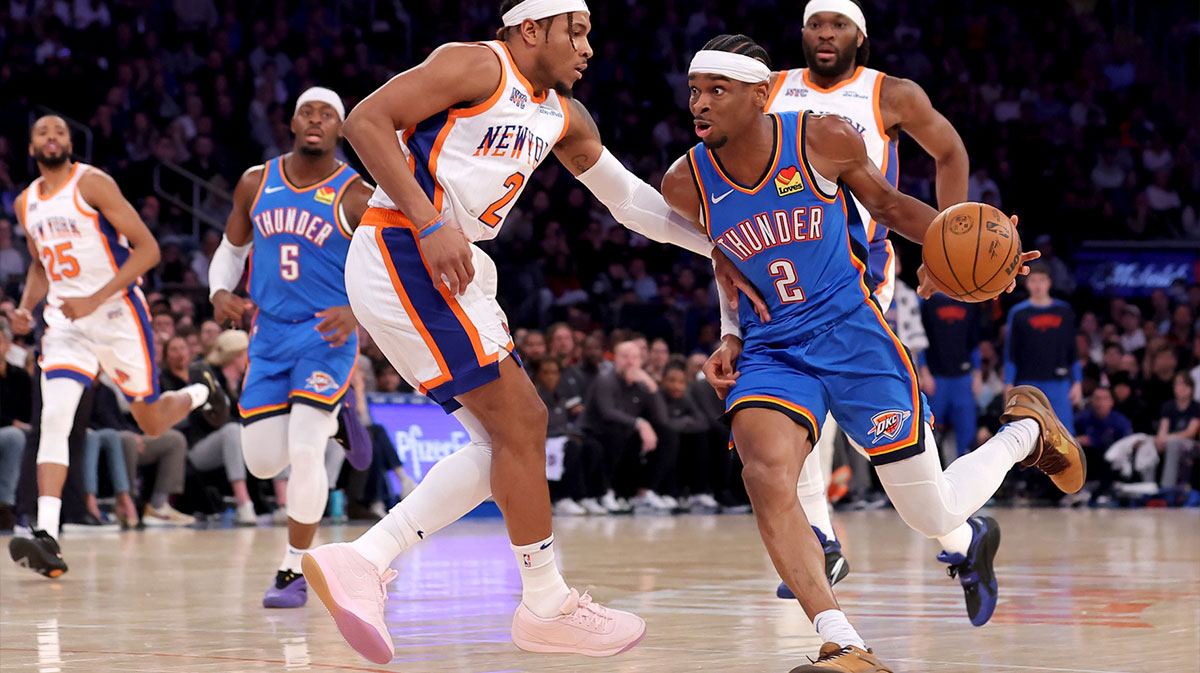 Thunder guard Shai Gilgeous-Alexander (2) drives to the basket against New York Knicks guard Miles McBride (2) and forward Precious Achiuwa (5) during the first quarter at Madison Square Garden