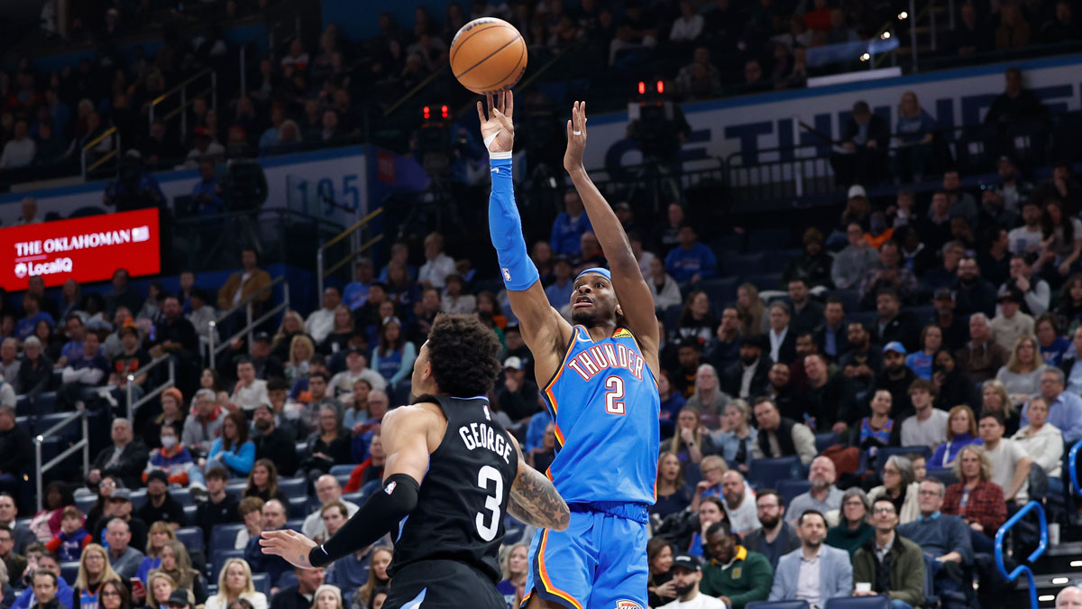 Thunder guard Shai Gilgeous-Alexander (2) shoots over Utah Jazz guard Keyonte George (3) during the second quarter at Paycom Center