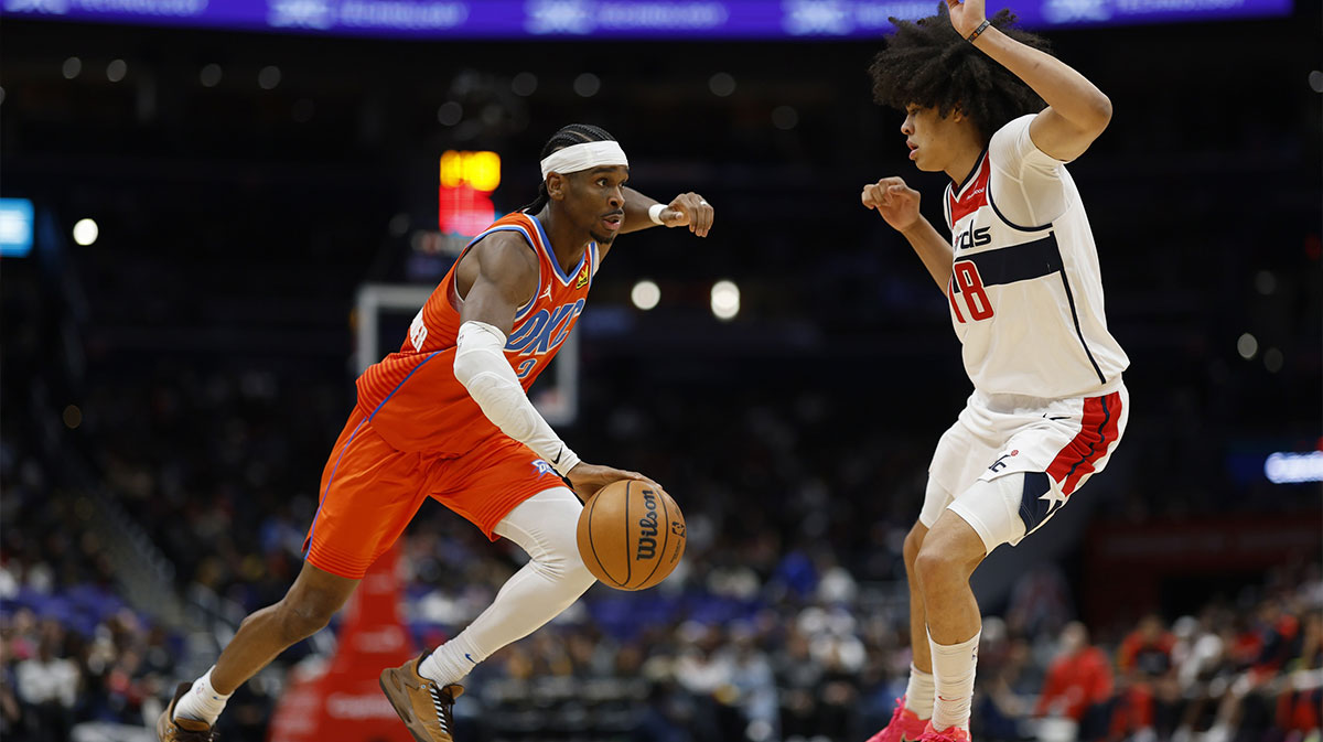 Thunder guard Shai Gilgeous-Alexander (2) drives to the basket as Washington Wizards forward Kyshawn George (18) defends in the third quarter at Capital One Arena