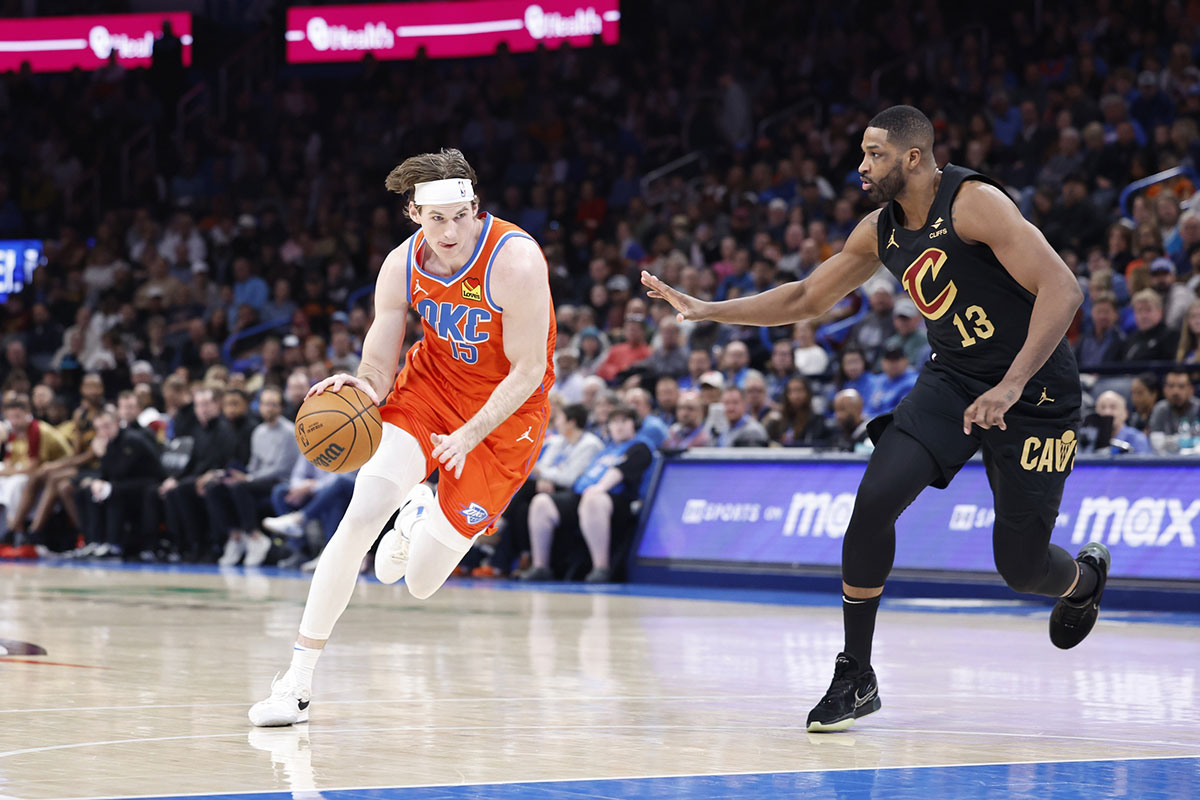 Thunder center Branden Carlson (15) drives around Cleveland Cavaliers center Tristan Thompson (13) during the fourth quarter at Paycom Center
