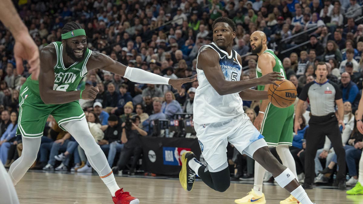 Timberwolves guard Anthony Edwards (5) drives past Boston Celtics center Neemias Queta (88) in the second half at Target Center