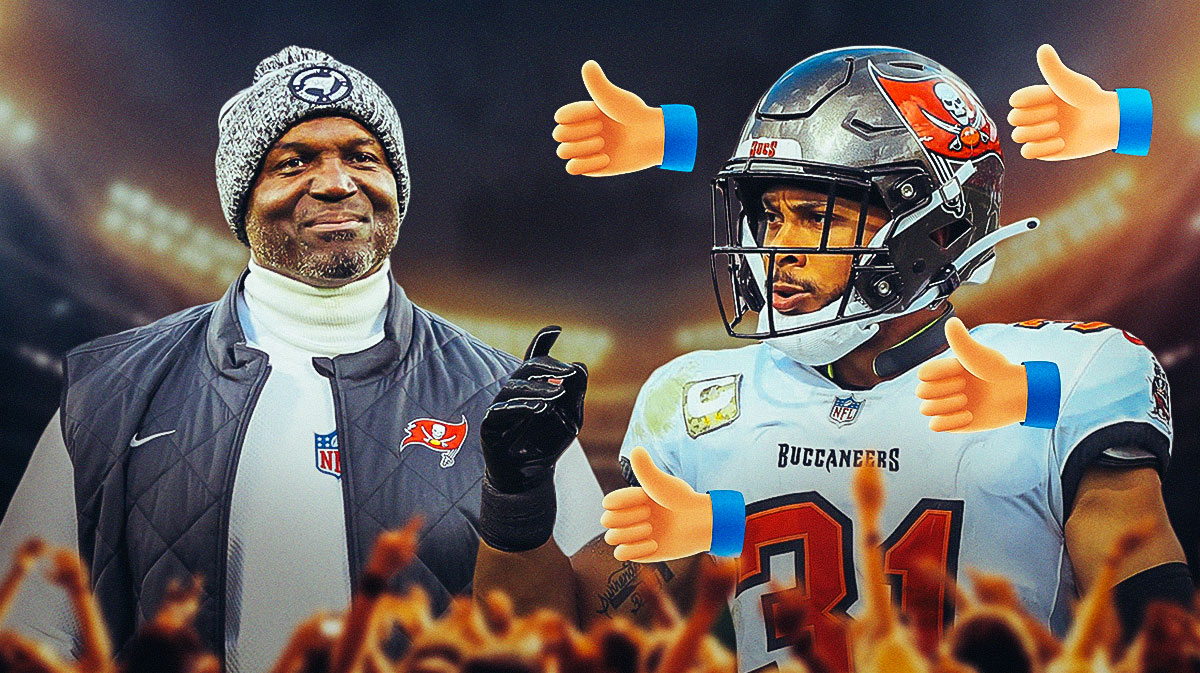 Buccaneers head coach Todd Bowles smiling, with safety Antoine Winfield Jr. and thumbs up around Winfield Jr.