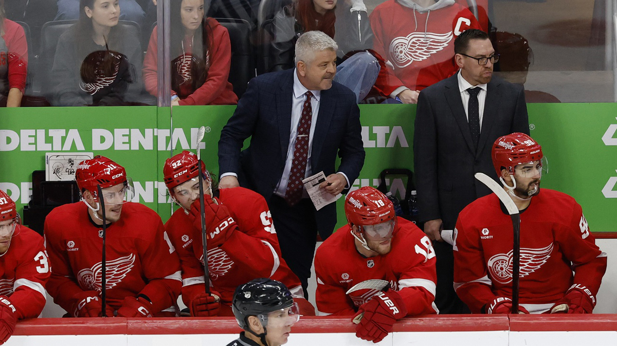 Detroit Red Wings coach Todd McClellan (center) stands on the bench during the third period against the Toronto Maple Leafs at Little Caesars Arena.