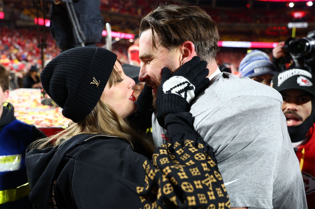 Recording artist Taylor Swift and Kansas City Chiefs tight end Travis Kelce (87) react after the AFC Championship game against the Buffalo Bills at GEHA Field at Arrowhead Stadium. 