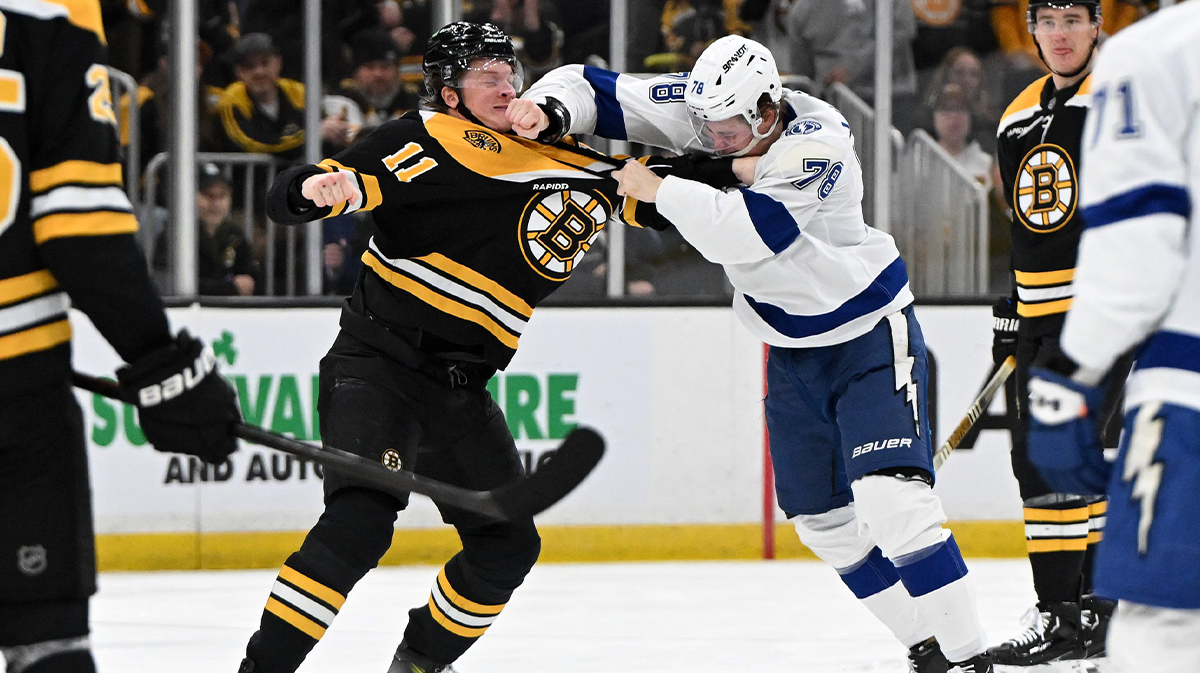 Boston Bruins center Trent Frederick (11) and Tampa Bay Lightning defenseman Emil Lilberg (78) battle it out during the second period at TD Garden.