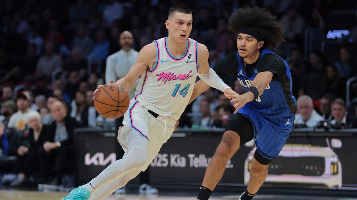 Miami Heat guard Tyler Herro (14) drives to the basket past Orlando Magic guard Anthony Black (0) during the second quarter at Kaseya Center.