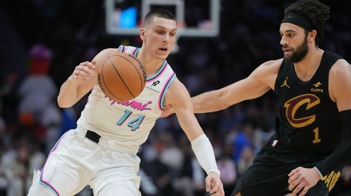 Miami Heat guard Tyler Herro (14) drives to the basket as Cleveland Cavaliers guard Max Strus (1) defends during the second half at Kaseya Center.