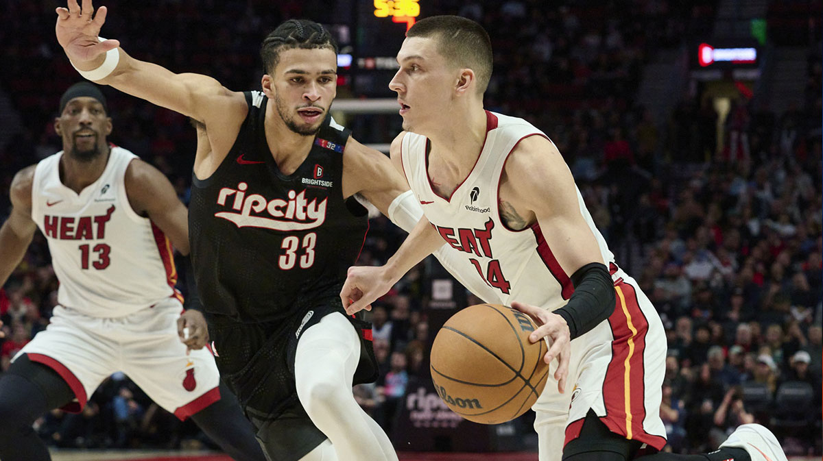 Miami Heat guard Tyler Hero (14) drives to the basket during the second half against Portland Trail Blazers forward Tumani Kamara (33) at the Moda Center