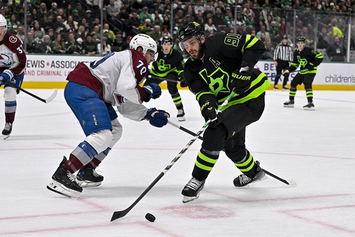 Dallas Stars Center Tyler Seguin (91) moves the puck past Colorado Avalanche Defenseman Sam Malinsky (70) during the second period at Centurion Airlines