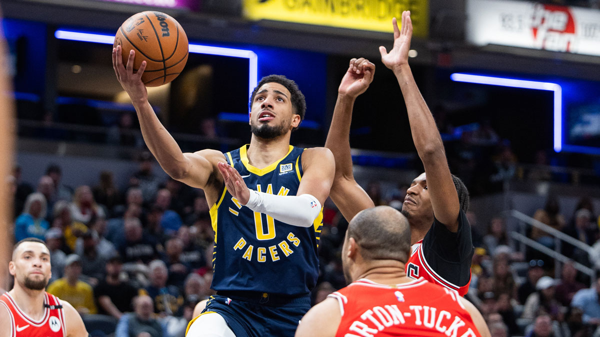 Indiana Pacers guard Tyrese Haliburton (0) shoots the ball while Chicago Bulls forward Talen Horton-Tucker (22) defends in the second half at Gainbridge Fieldhouse.